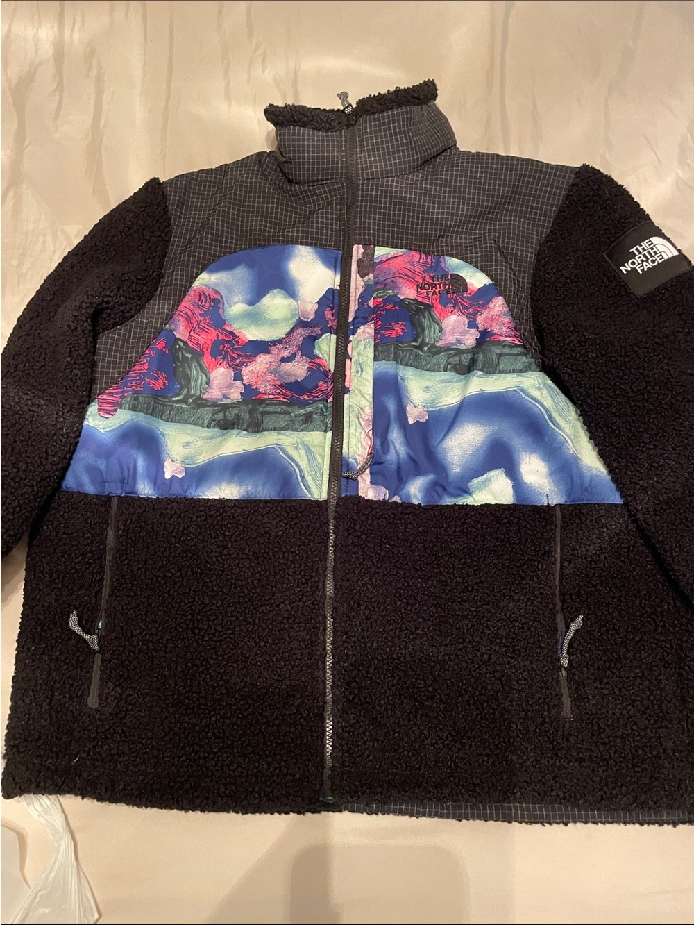 The North Face women’s black Sherpa Jacket with Multicolor Blue-Purple Chest
